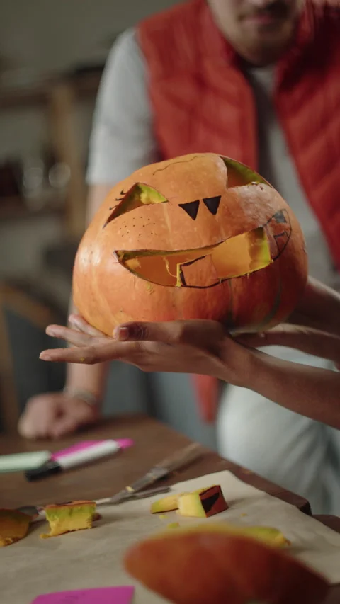 A young lady is showing a ready-made pumpkin Stock Footage 170269501
