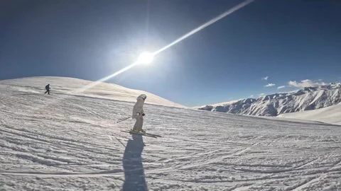 Young lady is skiing in on the slope of Gudauri ski resort, Georgia Видео 321623651