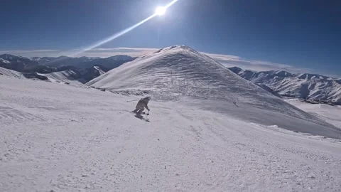 Young lady is skiing in on the slope of Gudauri ski resort, Georgia Stock Footage 321623653