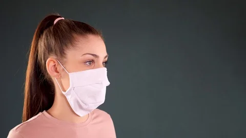 Young lady taking a mask on Stock Footage