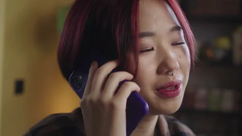 A young lady is talking on the phone Stock Footage 170204272