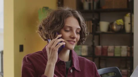 A young lady is talking with someone on the phone Stock Footage 170203959