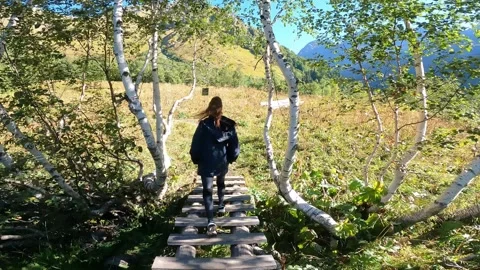 Young Lady tracking, Lake Kardyvach in Caucasian nature reserve, Sochi, Russia Stock Footage 321623255