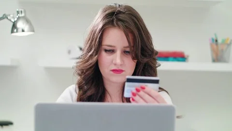A Young Lady Using a Laptop Indoors Stock Footage 83749934