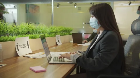A young lady is working and typing something on the computer Stock Footage 160174447