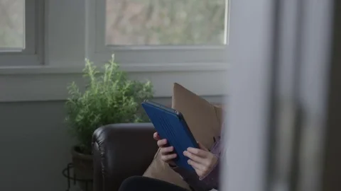 Young lady working on a tablet having a great experience Stock Footage 70809237