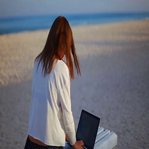 Young lady working with a text editor during vacation at the seaside Stock Footage 69465142