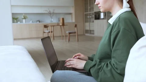 Young lady works at lap top at home Stock Footage 248471105