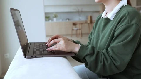 Young lady works at lap top at home Stock Footage 248558540