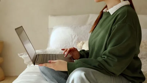 Young lady works at lap top at home Stock Footage 248644816