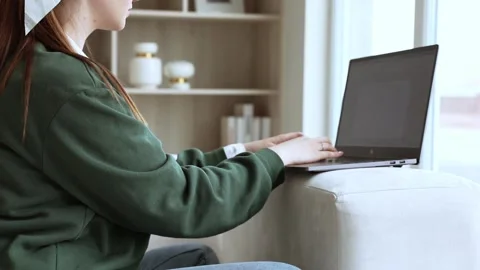 Young lady works at lap top at home Stock Footage 248644836