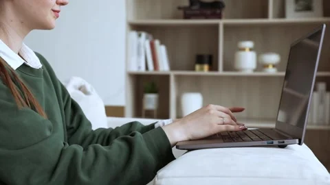 Young lady works at lap top at home Stock Footage 249017492