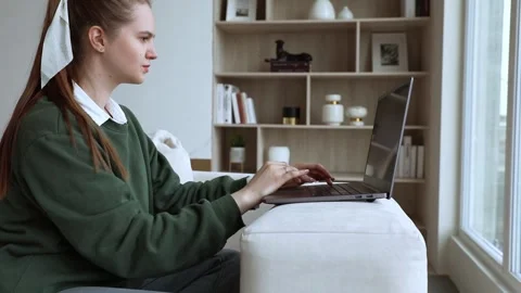 Young lady works at lap top at home Stock Footage 249112575