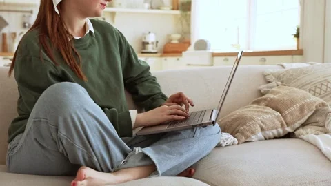 Young lady works at lap top at home Stock Footage 250043258