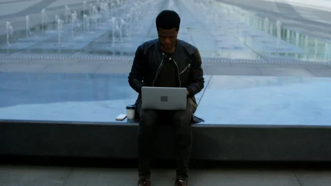 Young laptop user smiling at camera Stock Footage 90955107