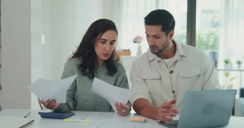 Young Latin couple on laptop computer check document paper pay bills online. Stock Footage 337040004