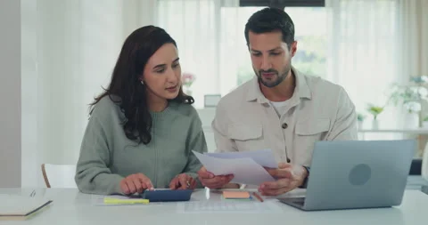 Young Latin couple on laptop computer check document paper pay bills online. Stock Footage 337040445