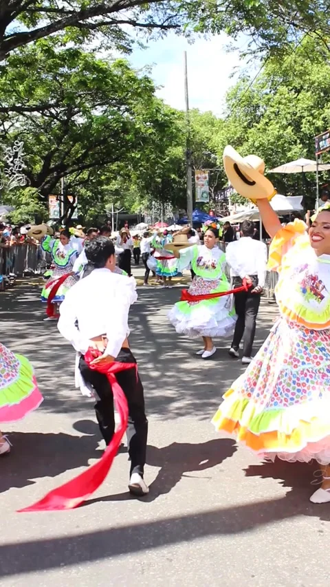 Young latin couples dancing in a parade Stock Footage 279994916