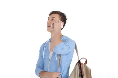 Young latin man with backpack using his smartphone Stock Photos