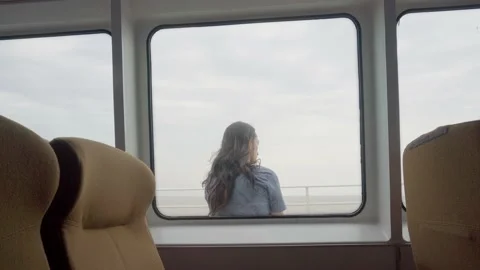 Young latin man on his back sitting quietly on the deck of a ferry and then.. Stock Footage 234550830