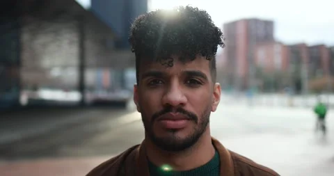 Young latin man looking on camera outdoor Stock Footage 175792681
