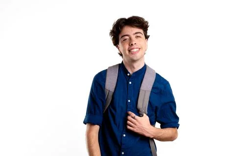 Young latin man smiling with backpack on white background Stock Photos