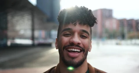 Young latin man smiling on camera outdoor Stock Footage 175792674