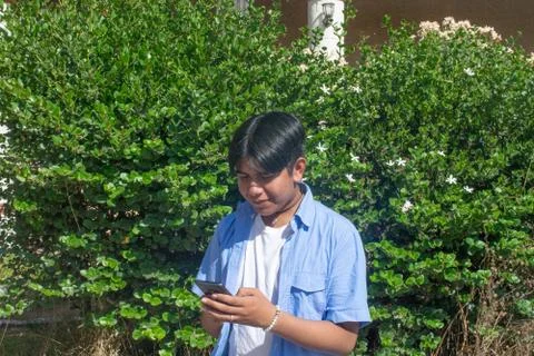 Young latin man using cell phone Stock Photos