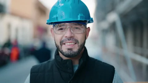 Young latin man worker smiling confident standing at street Video stock 170654788