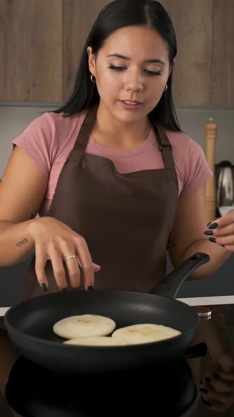 Toasting a Colombian Arepa on a Grill Stock Image - Image of