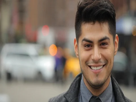 Young Latino Hispanic man in city smile happy face portrait Stock Footage