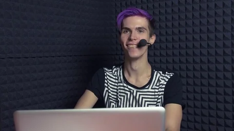 Young laughing Let's Player with purple bangs in web studio Stock-Footage 70803249