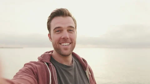 Young laughing man taking selfie Stock Footage 221517866