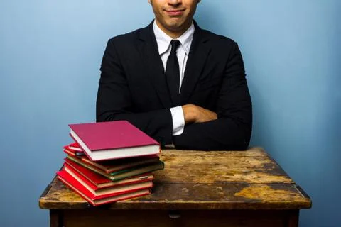 Young lawyer with stack of books 스톡 사진