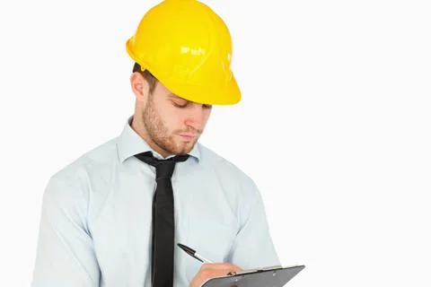 Young lead worker taking notes on his clipboard Stock Photos