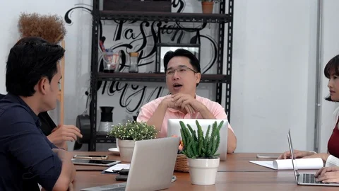 Young leader man talking with start up business team Stock Footage 102818863