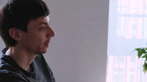 Young lean dark-haired man talking about something 動画素材 137533018