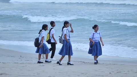 Young Learners Begin Daily School Journey Beside Coastal Waves In Palawan Stock Footage 336684893