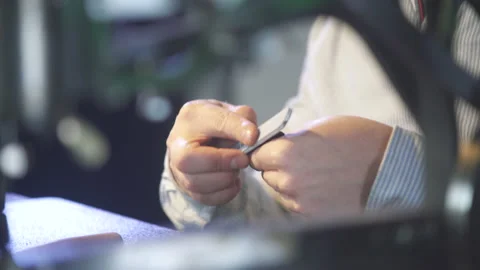 Young leather craftsman creates a DIY product. Handmade craft manufacture. Stock-Footage 130214847
