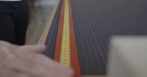Young leather worker measuring leather strip for making a belt Stock Footage 144888838