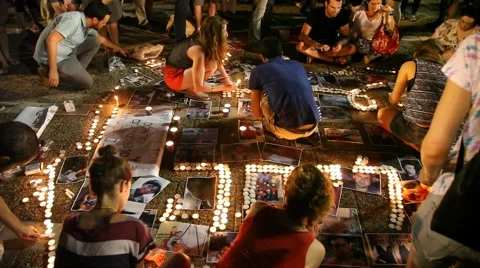 Young left wing activists use candles to illustrate the word SORRY 스톡 동영상 40457426