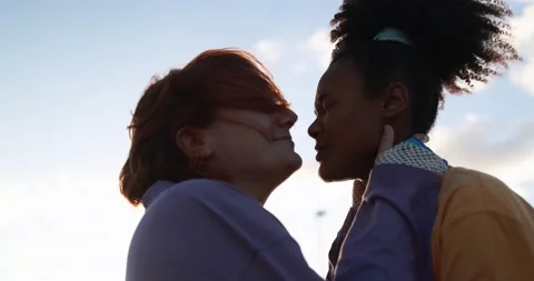 Young lesbian couple having tender moment together outdoor Stock Footage 170604656