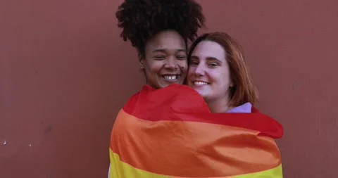 Young lesbian couple smiling on camera outdoor - LGBT pride concept Stock Footage 170604062