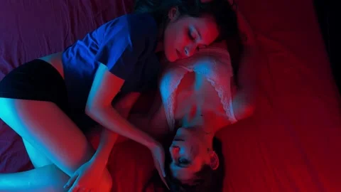 young lesbians lying on the bed caress e... | Stock Video