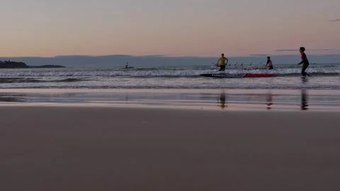 Young lifeguards finish training at sunset Manly beach Sydney 4K Video stock 252136464