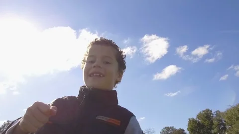Young little Boy Running - Dancing outdoors park. Slow Motion - blue sky Stock Footage 90732015