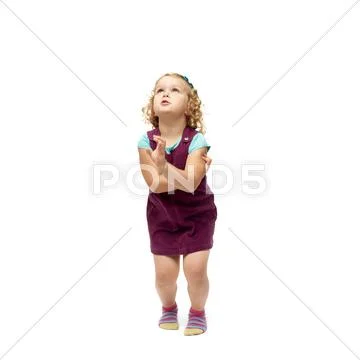 Young little girl jumping over isolated white background Stock Photos