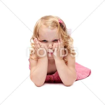 Young little girl lying over isolated white background Stock Photos