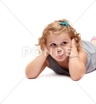 Young little girl lying over isolated white background Stock Photos