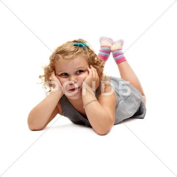Young little girl lying over isolated white background Stock Photos